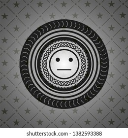 serious face icon inside black emblem