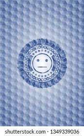 serious face icon inside blue emblem with geometric pattern background.