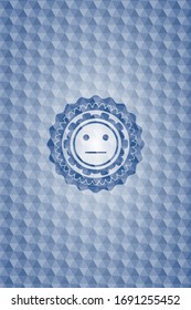 serious face icon inside blue emblem with geometric pattern.