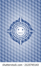 serious face icon inside blue emblem with geometric background. 