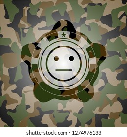 serious face icon inside camo texture