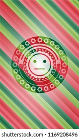 serious face icon inside christmas emblem.