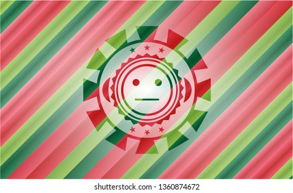 serious face icon inside christmas colors style badge.