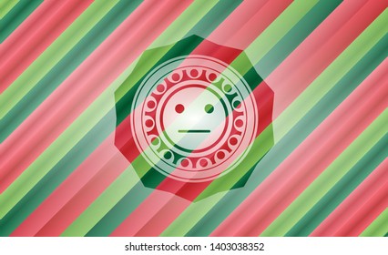 serious face icon inside christmas colors emblem.