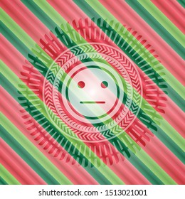 serious face icon inside christmas colors style badge.