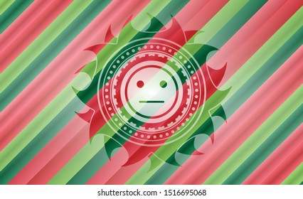 serious face icon inside christmas style emblem.