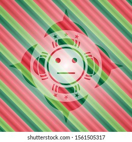 serious face icon inside christmas badge background.