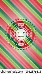 serious face icon inside christmas badge. 