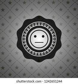 serious face icon inside dark badge or emblem