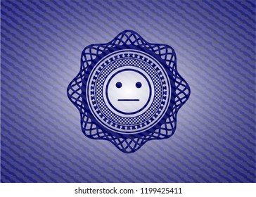 serious face icon inside emblem with denim high quality background