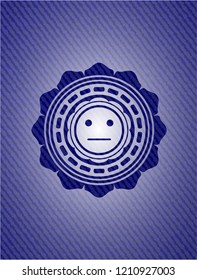 serious face icon inside emblem with jean texture