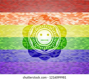 serious face icon inside emblem on mosaic background with the colors of the LGBT flag