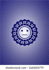 serious face icon inside emblem with jean background
