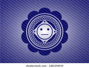 serious face icon inside emblem with jean background