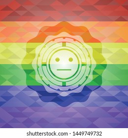 serious face icon inside emblem on mosaic background with the colors of the LGBT flag
