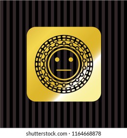 serious face icon inside gold shiny badge