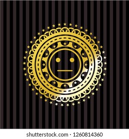 serious face icon inside gold emblem or badge