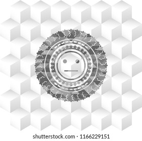 serious face icon inside grey icon or emblem with geometric cube white background