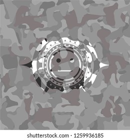 serious face icon inside grey camouflage texture