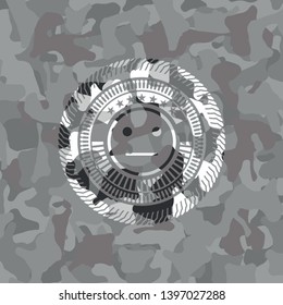 serious face icon inside grey camouflaged emblem