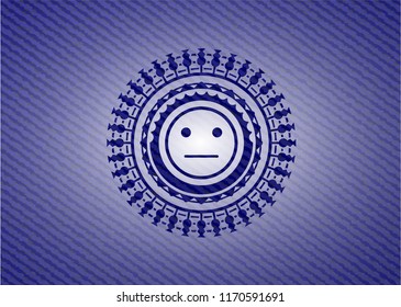 serious face icon inside jean or denim emblem or badge background