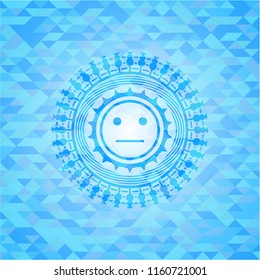 serious face icon inside light blue emblem. Mosaic background
