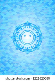 serious face icon inside light blue emblem. Mosaic background