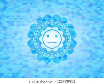 serious face icon inside realistic light blue emblem. Mosaic background