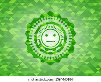 serious face icon inside realistic green mosaic emblem
