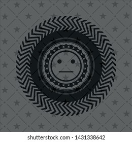 serious face icon inside realistic dark emblem