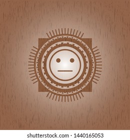 serious face icon inside realistic wooden emblem