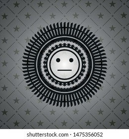 serious face icon inside realistic black emblem