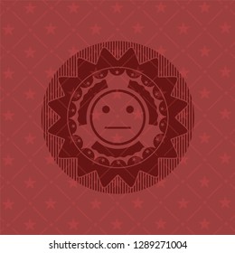 serious face icon inside red emblem. Retro