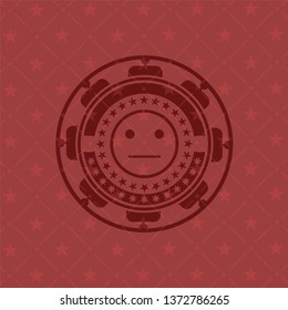 serious face icon inside red emblem