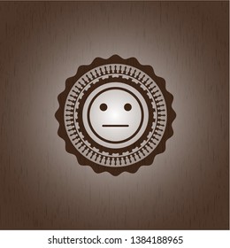serious face icon inside retro wood emblem