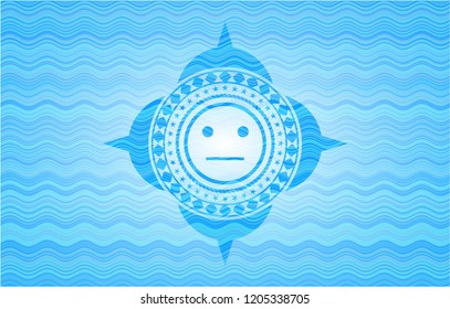 serious face icon inside water concept emblem.