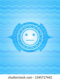 serious face icon inside water representation emblem background.