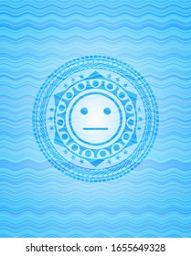 serious face icon inside water wave representation style emblem.