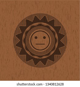 serious face icon inside wooden signboards