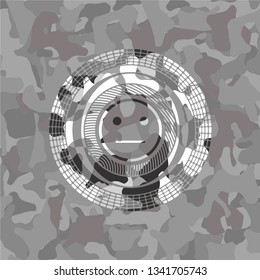 serious face icon on grey camouflaged pattern