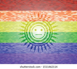 serious face icon on mosaic background with the colors of the LGBT flag