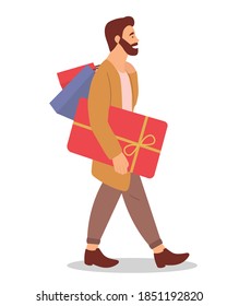 Hombre serio con cajas de regalo en las manos. Joven y guapo hombre de compras de moda aislado de fondo blanco. Publicidad de venta. El personaje masculino en la tienda está comprando regalos de navidad y sosteniendo compras