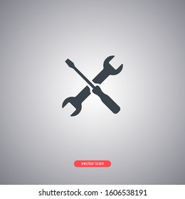 Service icon isolated on a gray background. Screwdriver and wrench. Vector illustration.