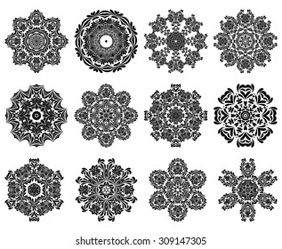 Set of 12 Circle Ornaments in Shape of Snowflakes.