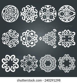 Set of 12 ethnic floral signs and design elements. Geometric patterns in white isolated on chalkboard background. Vector illustration. Could be used for textile, pillows, web-design, decoration, etc. 
