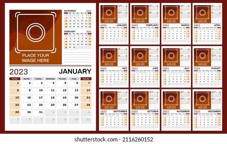 Set of 12 vertical calendar pages for 2023 in red and orange shades with place for photo. Vector design template. Week starts on Sunday.