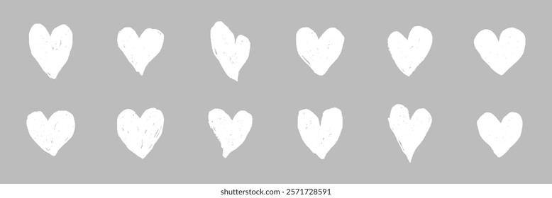 Set of 12 white hand-drawn hearts on a gray background. Hearts are sketched, creating a playful, artistic feel. Perfect for love-themed designs and crafts. White doodle Valentine's Day vector set.