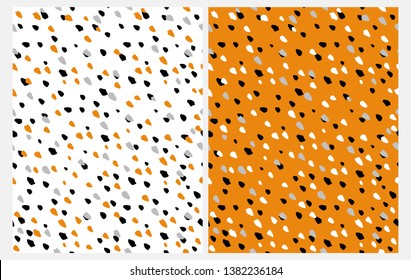 Set of 2 Abstract Seamless Vector Patterns with Hand Drawn Irrgegular Dots on a White and Orange Background. Black, Gray, White and Orange Geometrick Doted Design. Funny Repeatable Party Layouts. 