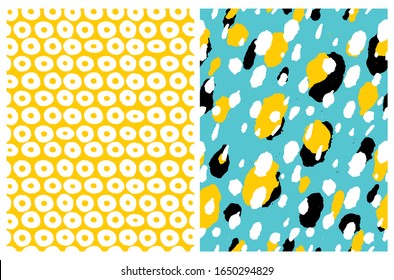 Set of 2 Cute Abstract Geometric Vector Pattern. White, Black and Yellow Irregular Brush Spots on a Blue Background. Abstract Wild Animal Skin Print. White Circles on a Yellow Background.