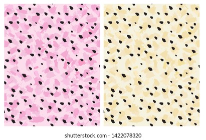 Set of 2 Cute Abstract Leoparard Skin Vector Pattern. Black Irregular Hand Drawn Brush Dots on a Pink and Yellow Background. Lovely Pastel Color Delicate Layouts. Abstract Wild Animal Skin Design.